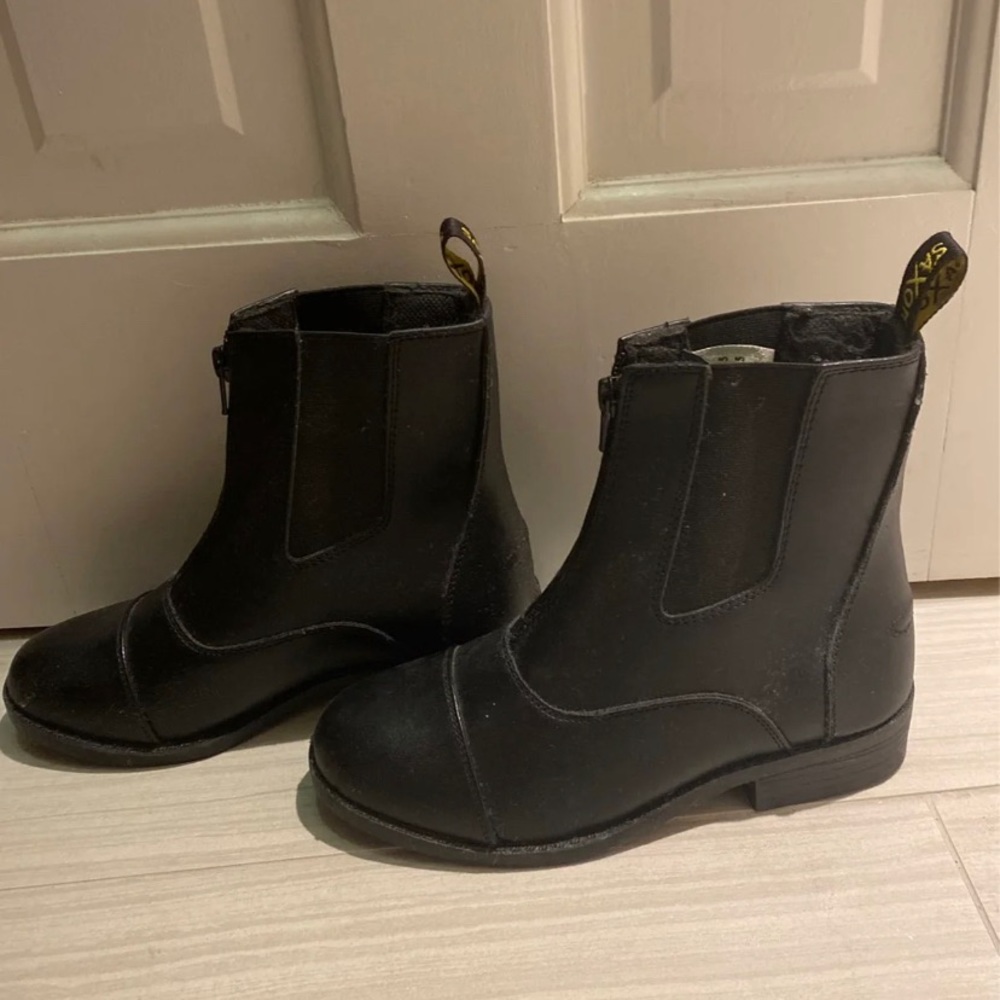 Black boots. Trendy but also for horseback riding